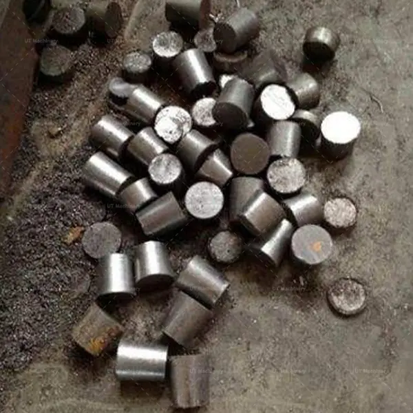 A pile of compressed uniform metal briquettes ready for smelting
