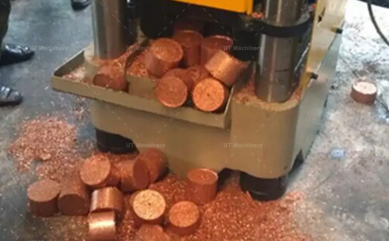 Real workshop footage of the Dual Outlet Briquette Press continuously discharging finished copper briquettes.
