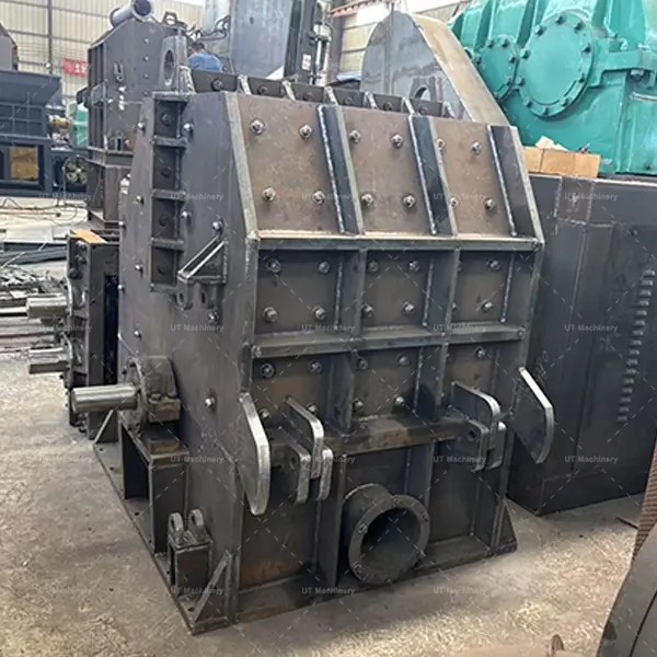 Reinforced thick steel plate chamber of the industrial crusher, featuring multiple heavy-duty bolts for durability.