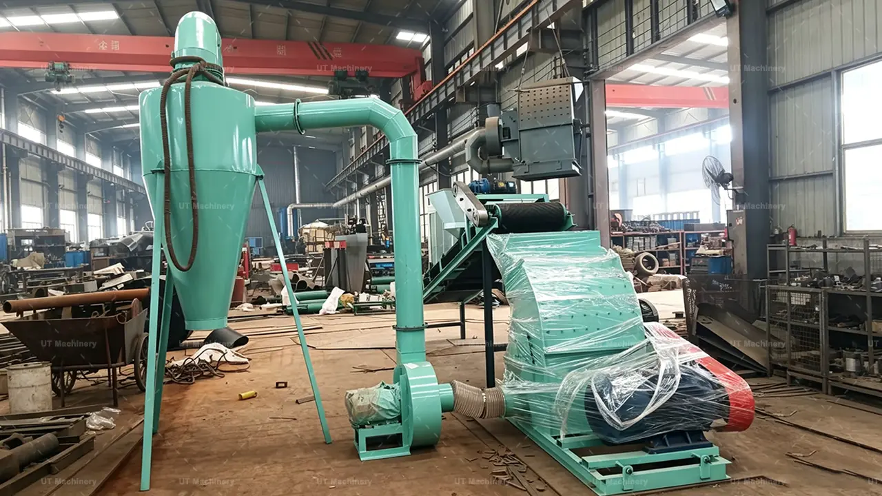 Side view of the multifunctional wood crusher featuring the belt feeding conveyor and high-pressure centrifugal blower system