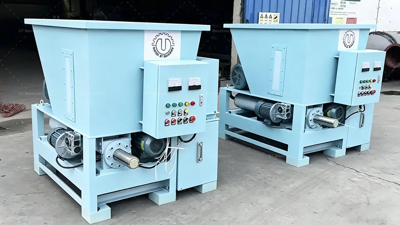 Two units of hydraulic biomass briquette machines for industrial waste-to-energy production.