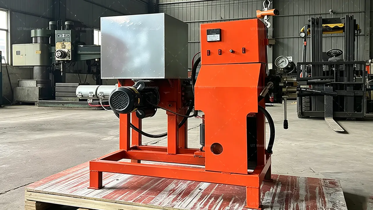 Rear view of the piston stamping briquette press showing the hydraulic motor and pressure gauge.