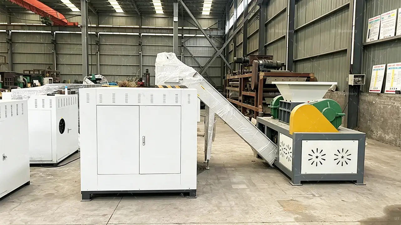 Turnkey automated metal waste processing system integrating a heavy-duty dual-shaft metal shredder machine with a continuous briquetting line.