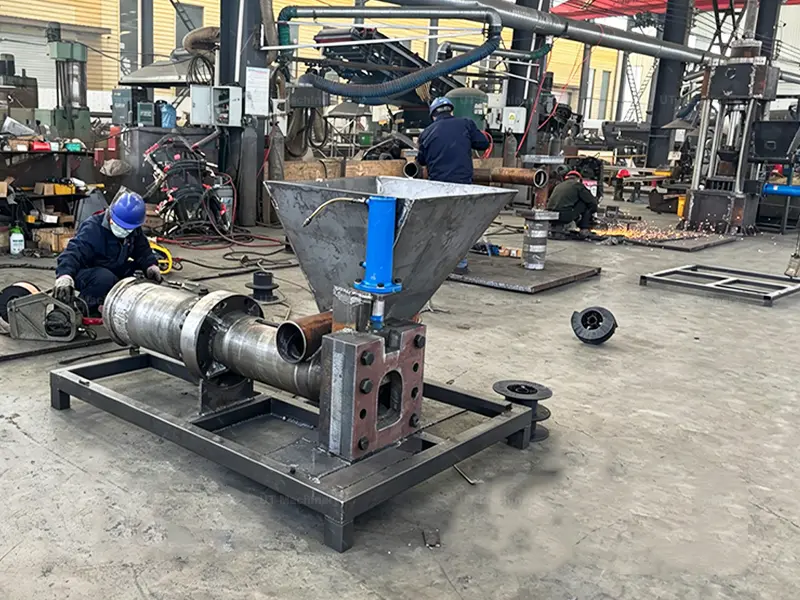 Internal hydraulic ram system and material feeding hopper integration during the metal scrap briquetting machine manufacturing process.
