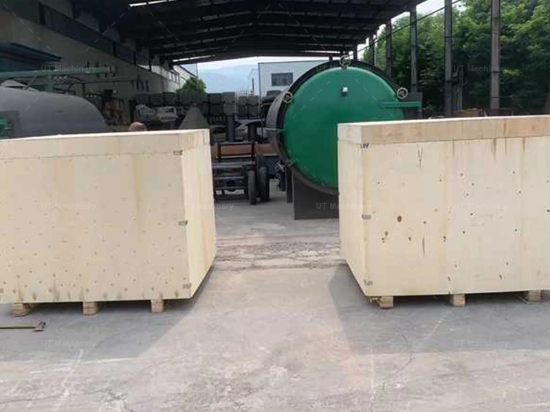 Biomass briquette machine components securely packed in wooden export crates, ready for international shipment to India from UT Machinery.