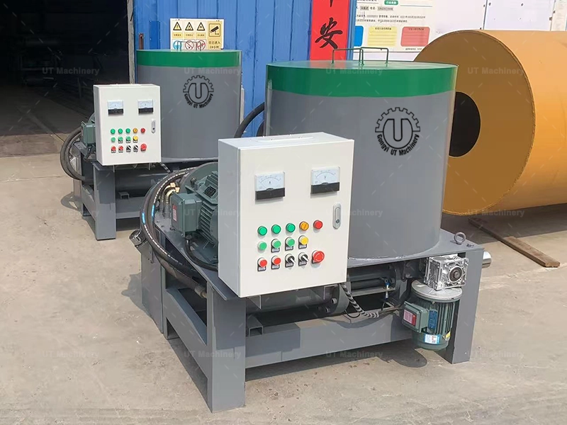 UT Machinery biomass briquette press machine undergoing final pre-shipment testing in the workshop, showing the hydraulic system and control panel.