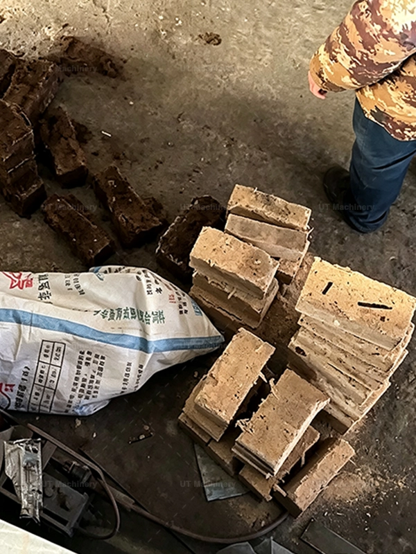 Inspecting compressed coco peat blocks and packaging on factory floor for moisture quality control