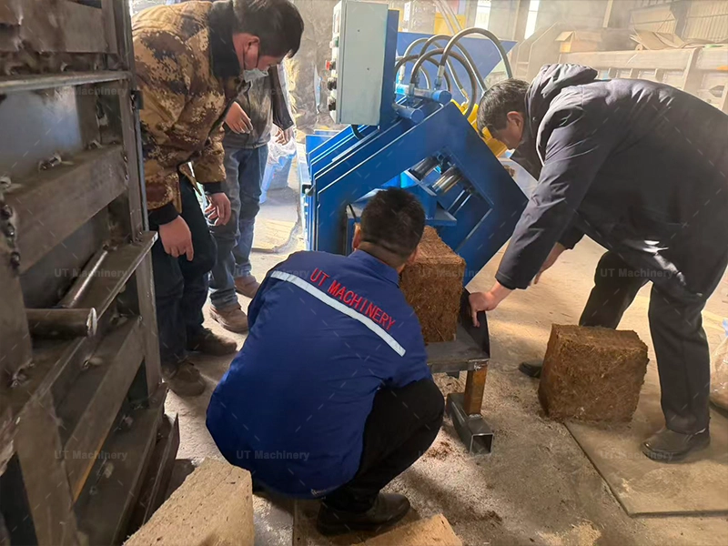 UT Machinery testing 5kg cocopeat briquette machine in factory before delivery using customer's coir pith material