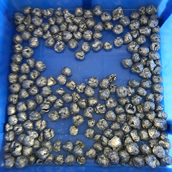 A bin full of fine, small-sized metal swarf particles, consistently crushed for efficient briquetting.